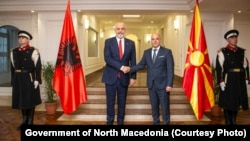 Albanian Prime Minister Edi Rama (left) and his counterpart from North Macedonia, Dimitar Kovachevski, shake hands in Skopje on November 14.