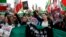 Women protest during an opposition rally in solidarity with the Iranian people on the 44th anniversary of the Islamic Revolution in Paris on February 11.
