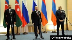 Azerbaijani President Ilham Aliyev (left to right), Russian President Vladimir Putin, and Armenian Prime Minister Nikol Pashinian speak at a press briefing in Sochi, Russia, on November 26.