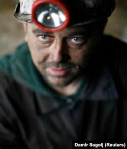 A miner photographed after emerging from underground in the Sretno mine