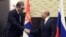 Russian President Vladimir Putin (right) shakes hands with Serbian counterpart Aleksandar Vucic in Sochi on November 25.