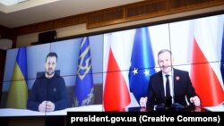 Ukrainian President Volodymyr Zelenskiy (left) on January 9 discussed further defense cooperation and Ukraine’s air-defense needs in a phone call with Polish President Andrzej Duda. (file photo)