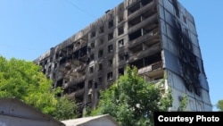 Будинок в Маріуполі, після російських обстрілів