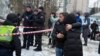 People react at the site of a Russian attack in Kyiv on January 23. 