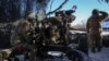 Ukrainian soldiers fire a L119 howitzer at Russian positions near the front line town of Maryinka in the eastern Donetsk region earlier this month.