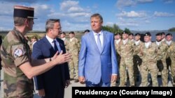 Romanian President Klaus Iohannis and Luxembourg Prime Minister Xavier Bettel visit the NATO base in Cincu, Romania, on September 5.