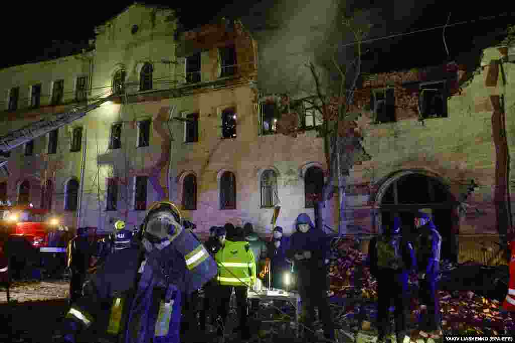 Ukrainian rescuers work at the site of a residential building in Kharkiv.&nbsp; Syniehubov said that according to preliminary information, the city was hit by two converted S-300 anti-aircraft missiles.&nbsp;