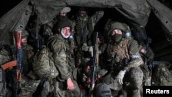 Fighters with the Wagner private mercenary group pull out of the Russian city of Rostov-on-Don on June 24 following their abortive mutiny the previous day. 