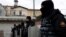Turkish police stand guard outside the Italian Santa Maria Catholic Church after the shooting on January 28.