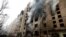 Firefighters in Kyiv work at a residential building that was heavily damaged during a Russian missile attack on January 2. 