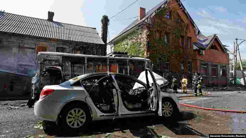 A burned-out car and bus that were destroyed after being hit by shelling.