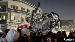 لاشه خودروی حامل یک فرمانده ارشد کتائب حزب‌الله عراق که شامگاه چهارشنبه هدف حمله نیروهای آمریکایی قرار گرفت