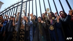 Members of the Mujahedin-e Khalk protest the police action on June 20 in Tirana.