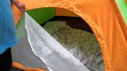 'It's Scary': Residents Of Shelled Kharkiv Buildings Sleep In Tents To Stay Safe
