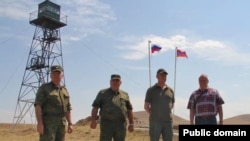 Armenia - Russian Ambassador Sergei Kopyrkin (right) poses for a photograph with Russian border guards on the Armenian-Turkish border, August 12, 2022.