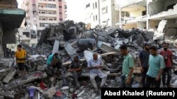 Нусейрат качкындар лагери израилдик аскерлердин соккусунан кийин. Газа, 9-июнь 2024-жыл 
