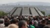 People march on April 24 to the Tsitsernakaberd memorial in Yerevan to commemorate the Armenian genocide.
