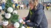 Relatives of prisoners of war decorated a Christmas tree with balloons bearing the names of soldiers in Dnipro, southeastern Ukraine, on December 24. 