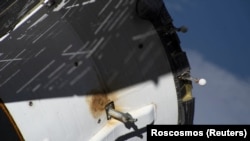 A view shows external damage believed to have caused a loss of pressure in the cooling system of the Soyuz MS-22 spacecraft docked at the ISS.