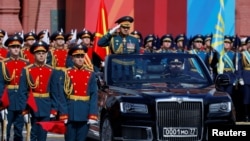 Russia - Russian Defense Minister Sergei Shoigu rides on an Aurus cabriolet during a military parade marking the 79th anniversary of the Soviet victory over Nazi Germany, Moscow, May 9, 2024.