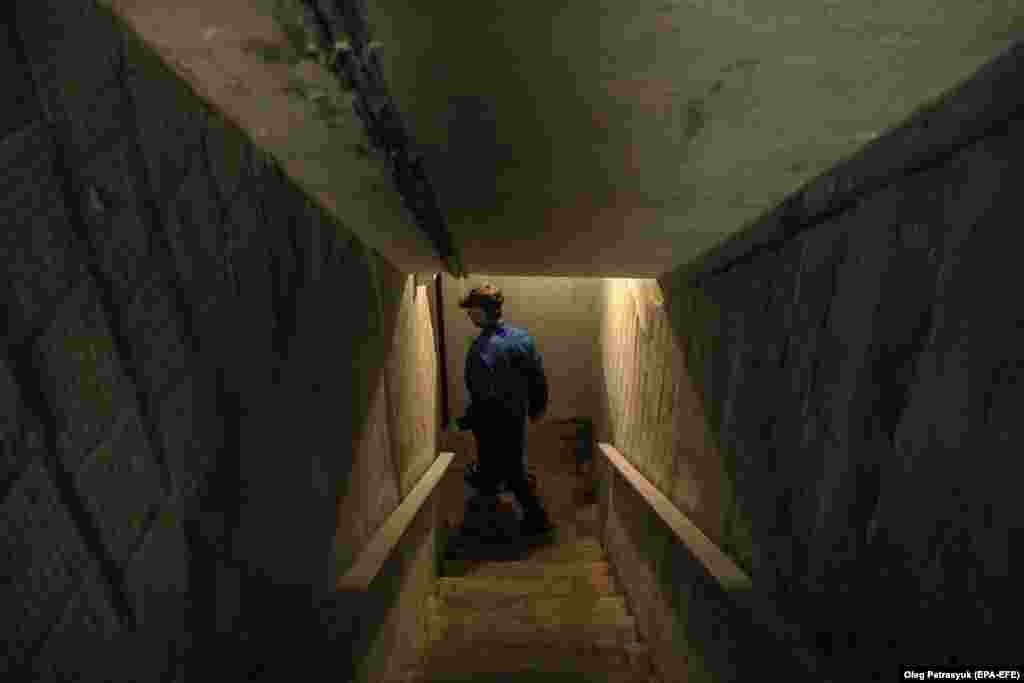 A man leads journalists into a Kyiv bomb shelter on June 5.&nbsp; The issue of access to bomb shelters has taken center stage in in Ukraine after authorities said on June 3 that from &quot;over 4,800&quot; shelters inspected across the country, 252 were locked and a further 893 were &quot;unfit for use.&quot;
