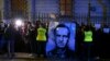 Demonstrators hold a portrait of Russian opposition leader Aleksei Navalny during a rally in front of the Russian Embassy in Warsaw on February 16. 