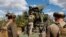 Ukrainian soldiers prepare to fire from the 2C22 Bohdan self-propelled howitzer toward Russian positions in eastern Ukraine.