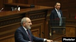 Armenia - A bodyguard stands near Prime Minister Nikol Pashinian as he speaks in the Armenian parliament, Yerevan, February 7, 2024.