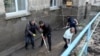 Armenia- People shovel mud from a flooded courtyard in Alaverdi, May 28, 2024.
