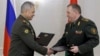 Russian Defense Minister Sergei Shoigu (left) and Belarusian Defense Minister Viktor Khrenin in Minsk on May 25.