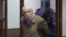 Researcher Anatoly Maslov enters a St. Petersburg court shortly before his conviction on a treason charge he denies on May 21.