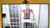 Ilya Yashin appears via video link during a court hearing in Moscow on April 19.