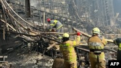 "Крокус Ситиде" жүргөн ӨКМ кызматкерлери. Орусия. 23-март, 2024-жыл. 