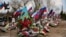 Flags wave over the recent graves of Russian soldiers killed in Ukraine at a cemetery in Russia’s Volgograd region.