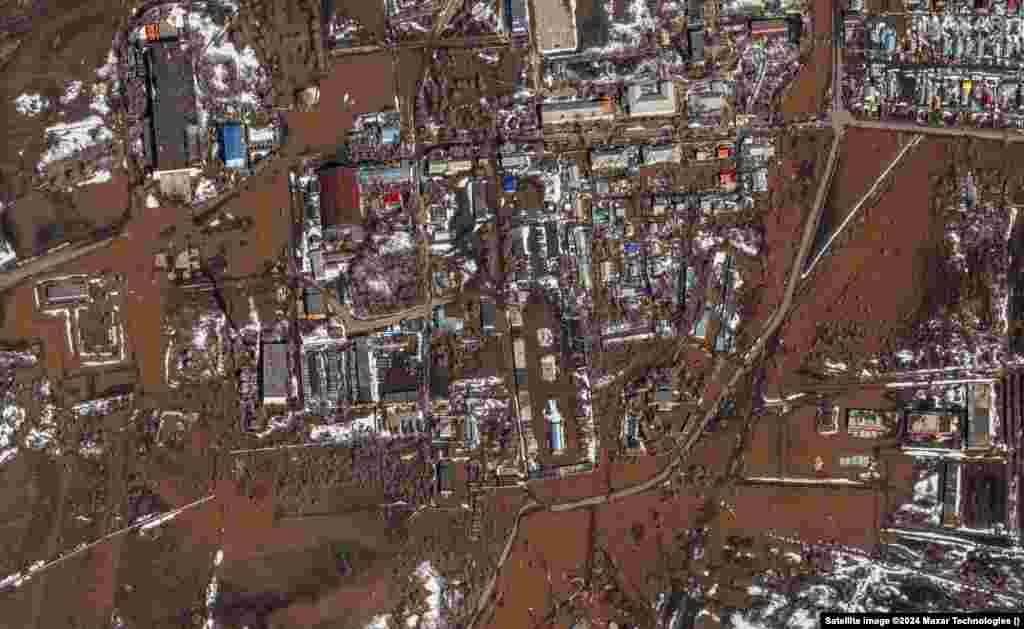 A satellite image released by Maxar Technologies shows floodwaters in the Russian city of Orenburg on April 9. Russia is struggling to contain flooding resulting from swiftly melting snow and a dam breach in the city of Orsk in the Ural Mountains.