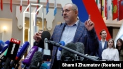 Boris Nadezhdin talks to journalists as he visits the Central Election Commission to submit documents and signatures in support of his candidacy in March's presidential election, in Moscow on January 31. 