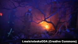 Firefighters work at the scene after a Russian drone strike in the Odesa region on December 17.