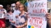 Protesters join a demonstration under the moniker "Putin is a Killer" organized by supporters of imprisoned Russian opposition leader Alexei Navalny, in Podgorica, Montenegro, on August 20.