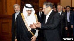 The visit to Abu Dhabi by Iranian Supreme National Security Council Secretary Ali Shamkhani (right) comes on the heels of a March 10 meeting in Beijing with Saudi Arabia's state minister, Musaad bin Muhammad al-Aiban (left). 