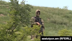 Armenia - An Armenian soldier guards new border posts in Kirants villahge, May 23, 2024.