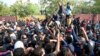 Supporters of Pakistan's former Prime Minister Imran Khan gather outside a court in Islamabad on March 18.