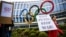 Protesters outside the IOC's headquarters in Lausanne demand the exclusion of Russian athletes from next summer's Olympic Games in Paris. (file photo)