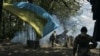 UKRAINE – Ukrainian soldiers fire a cannon near Bakhmut, an eastern city where fierce battles against Russian forces have been taking place, in the Donetsk region, May 12, 2023