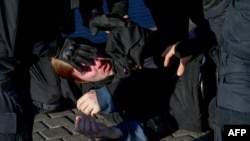 Police officers detain a man in St. Petersburg on September 24, 2022, following calls to protest against mobilization. OVD-Info focuses on the right to freedom of assembly and expression and combating political persecution in Russia.