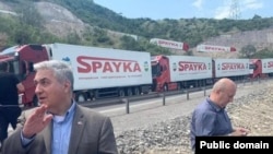 Armenia - U.S. diplomat John Allelo (left) inspects an Armenian aid convoy stuck near the Lachin corridor July 28, 2023.