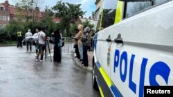 عکس آرشیوی از حضور پلیس سوئد در صحنه قرآن‌سوزی در استکهلم