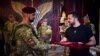 Ukrainian President Volodymyr Zelenskyi (right) meets with some of his country's combat brigades in the Zaporizhzhya region on September 4. 