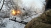 Ukrainian soldiers fire a 2S1 Gvozdika self-propelled howitzer toward Russian positions near the town of Chasiv Yar in the Donetsk region.