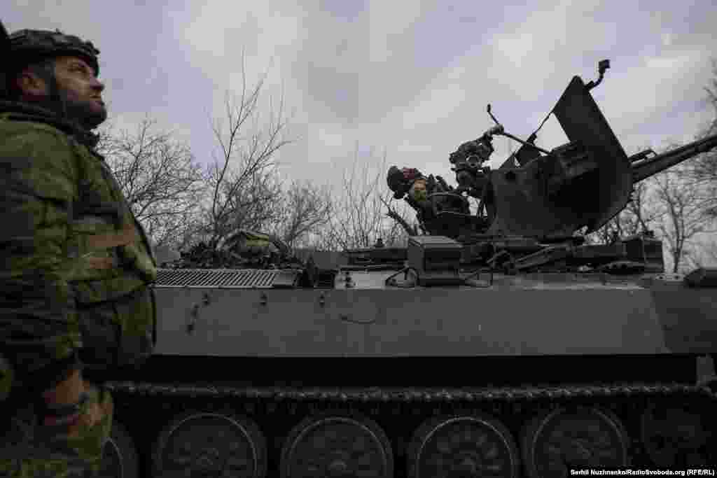 As they take up position, they must eye the sky for Russian drones that can attack at any moment. &nbsp;