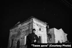 Father Mikhail near the church in the village of Antsiferovo.